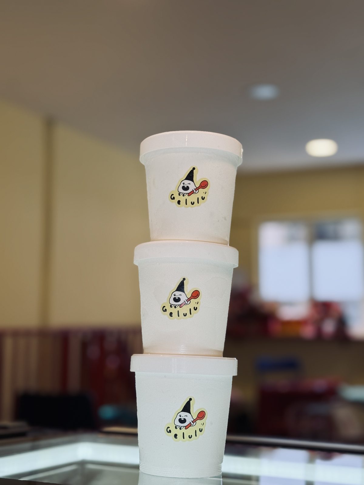 Three Gelulu pints stacked on the counter